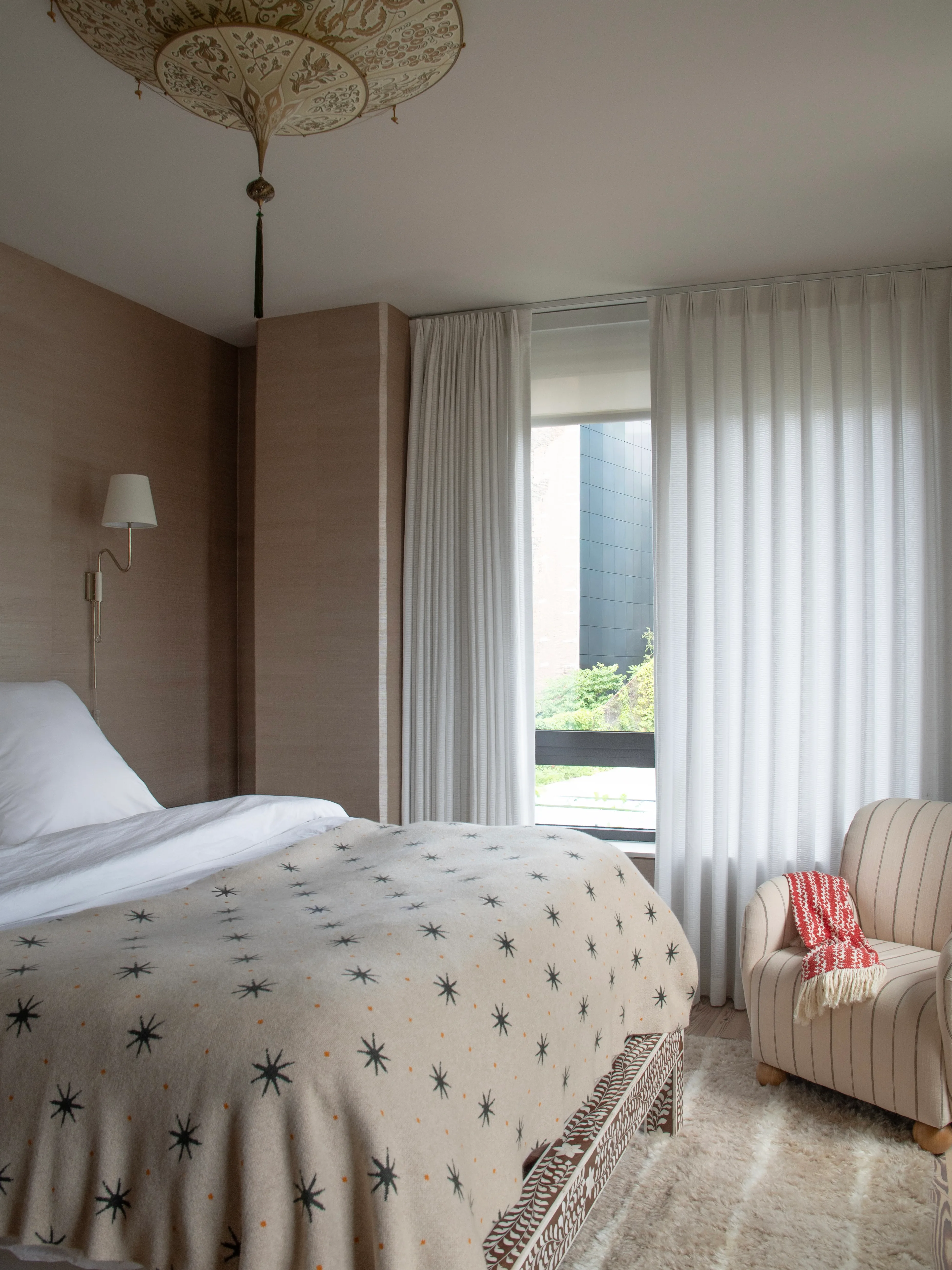 Primary bedroom with custom headboard